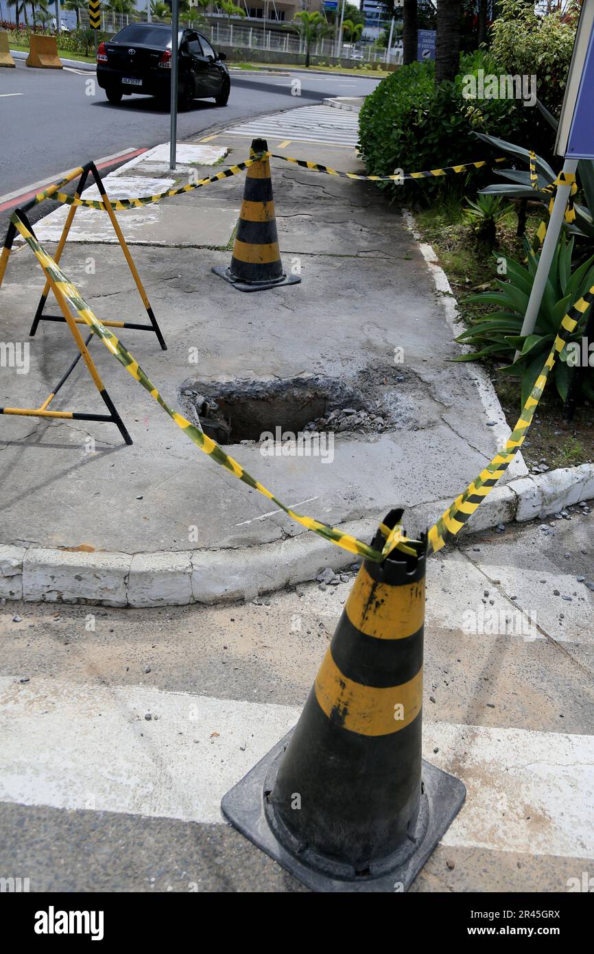 salvador, bahia, brazil may 16, 2023 cone and safety tape local mark with hole on the