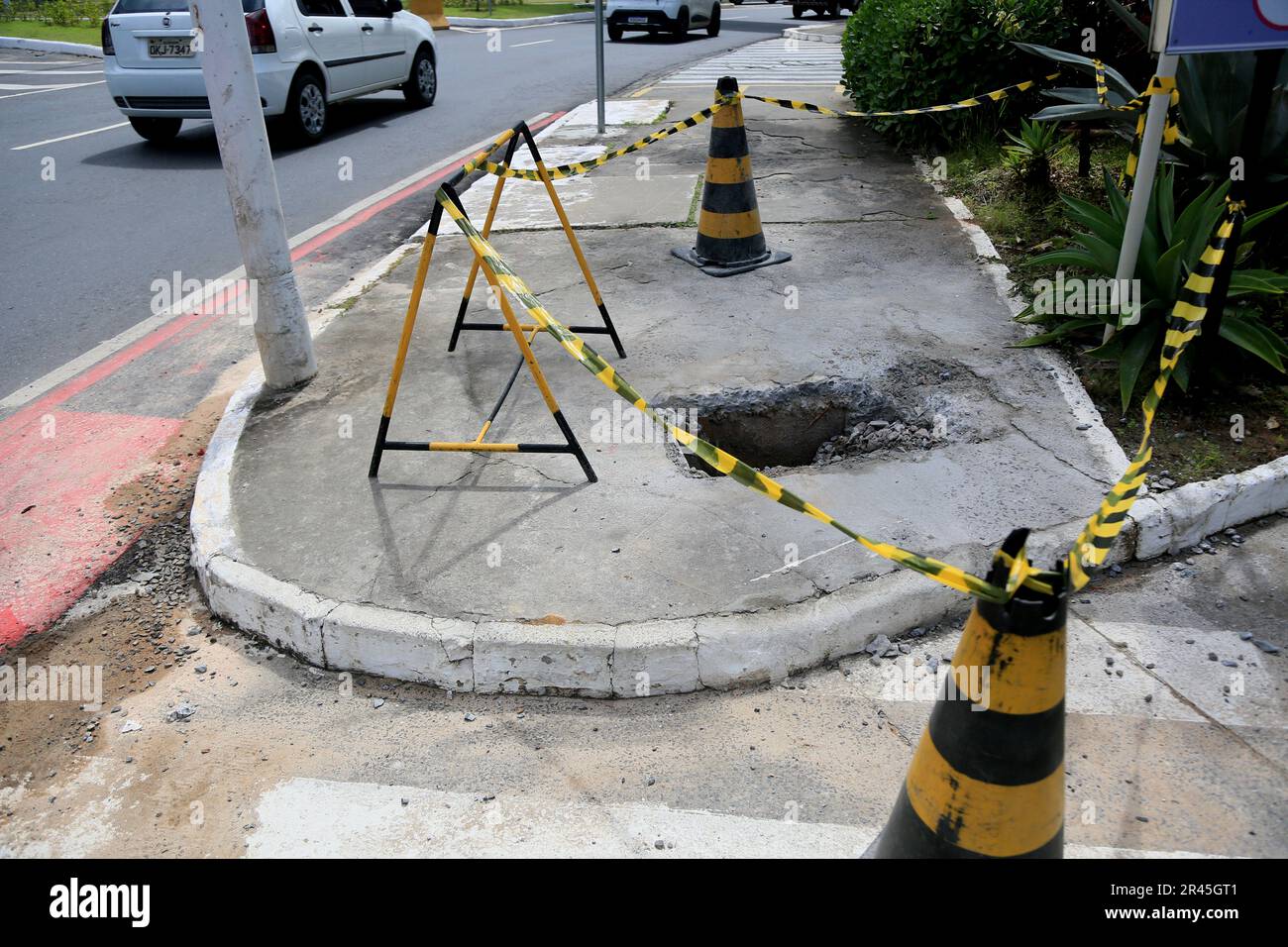 salvador, bahia, brazil may 16, 2023 cone and safety tape local mark with hole on the