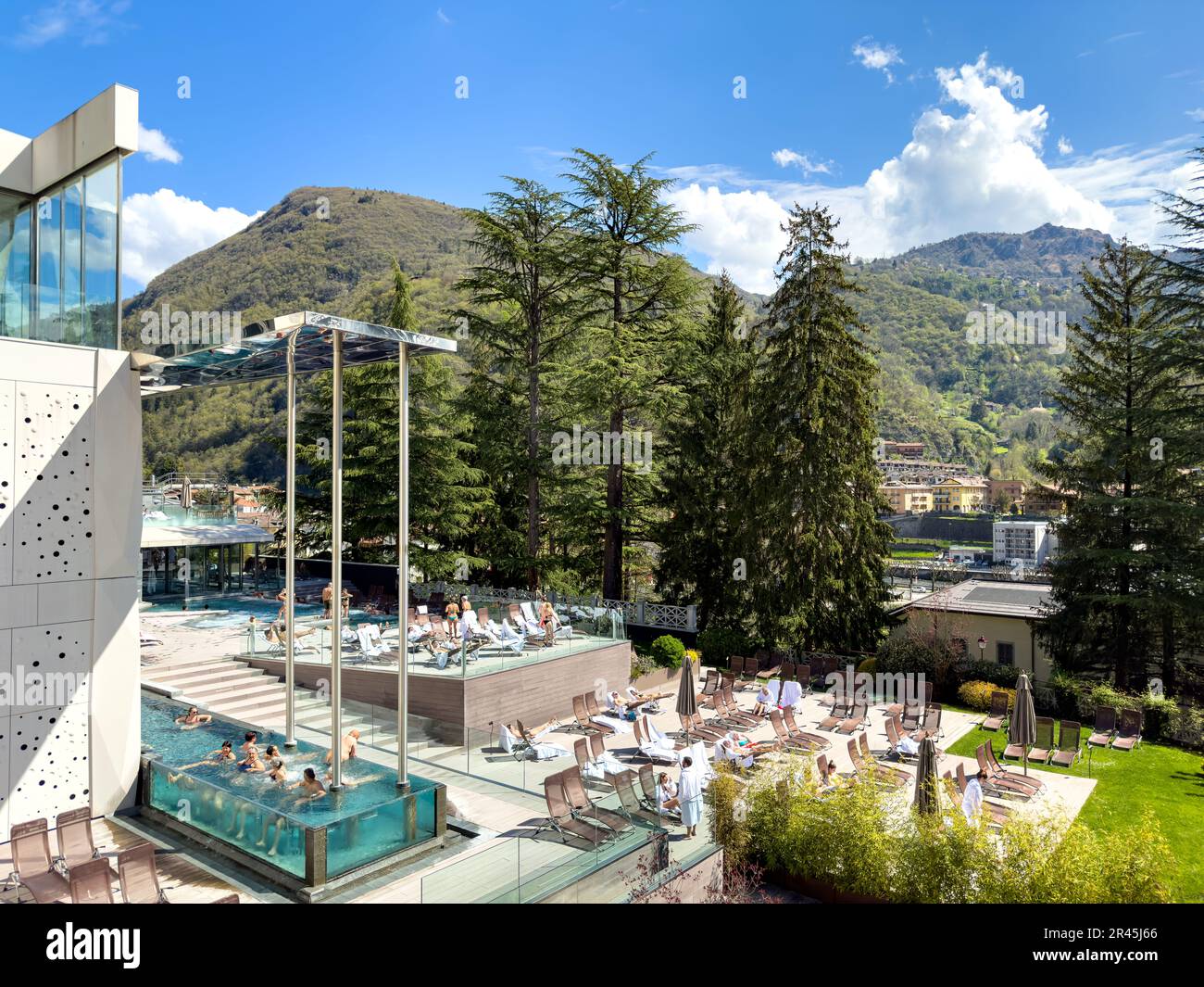 Guests enjoying the outdoor pools at the QC San Pellegrino Spa in Bergamo, Italy Stock Photo