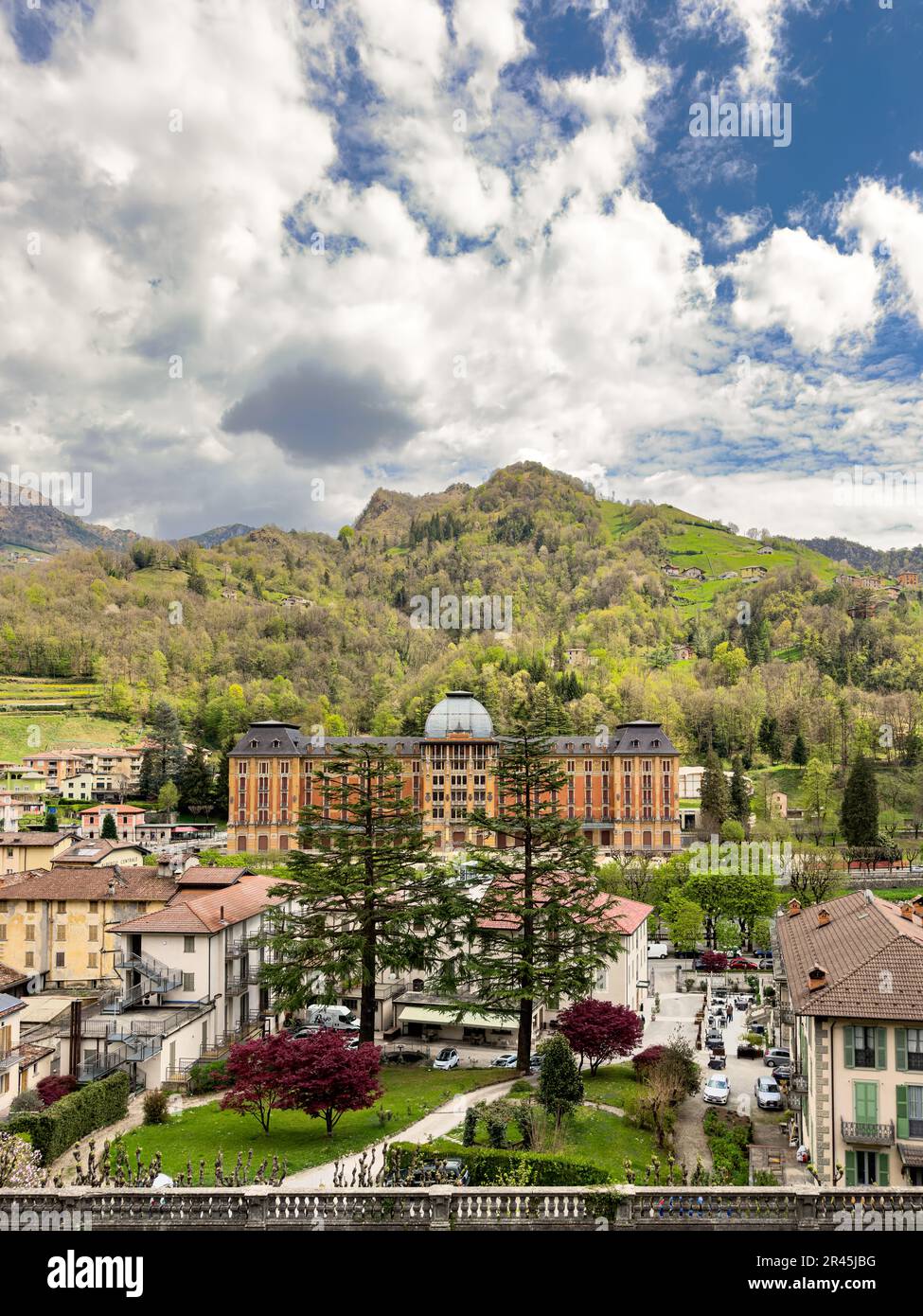 View of San Pellegrino Terme in Bergamo, Lombardy, Italy as seen from the QC San Pellegrino Spa. The empty Grand Hotel can be seen in the image. Stock Photo