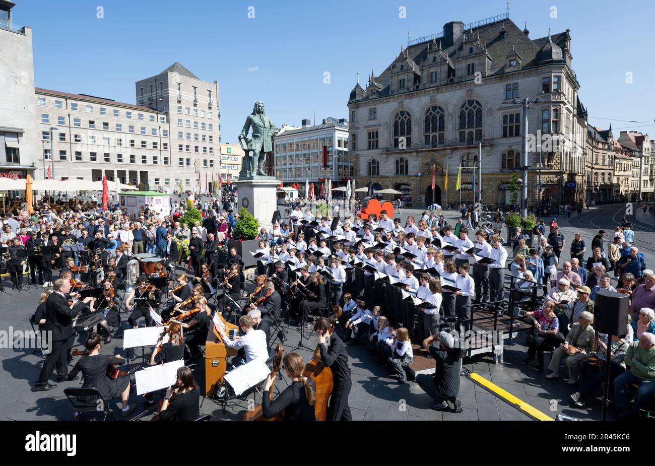 26 May 2023, Saxony-Anhalt, Halle (Saale): The boys of the Halle City Singing Choir under the direction of Clemens Flämig (l), the brass ensemble Latina Brass, and the Academic Orchestra of Martin Luther University will perform at the Handel Monument in Halle/Saale at the opening ceremony of the Handel Festival 2023. With around 70 events at 17 venues, the Handel Festival will begin in the afternoon with a ceremony at the Handel Monument on the city's market square. Until June 11, the birthplace of George Frideric Handel (1685-1759) will be dominated by baroque music with many concerts and als Stock Photo