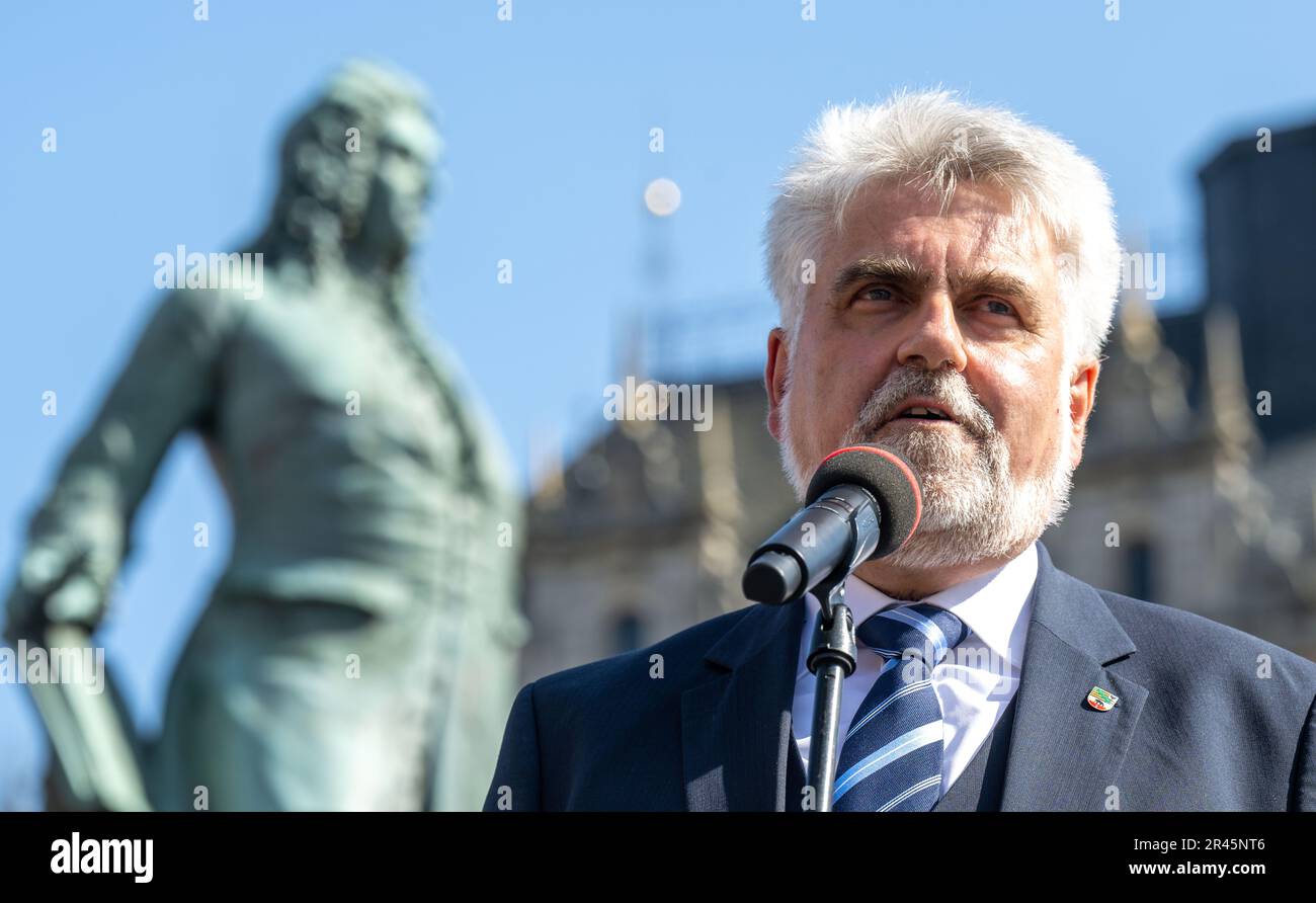 26 May 2023, Saxony-Anhalt, Halle (Saale): Armin Willingmann (SPD), Minister of Science and Deputy Minister President of Saxony-Anhalt, speaks at the opening ceremony of the Handel Festival at the Handel Monument on the market square in Halle/Saale. With around 70 events at 17 venues, the Handel Festival will begin this afternoon with a ceremony at the Handel Monument on the city's market square. Until June 11, the birthplace of George Frideric Handel (1685-1759) will be dominated by baroque music with many concerts and also cross-genre formats. Photo: Hendrik Schmidt/dpa Stock Photo