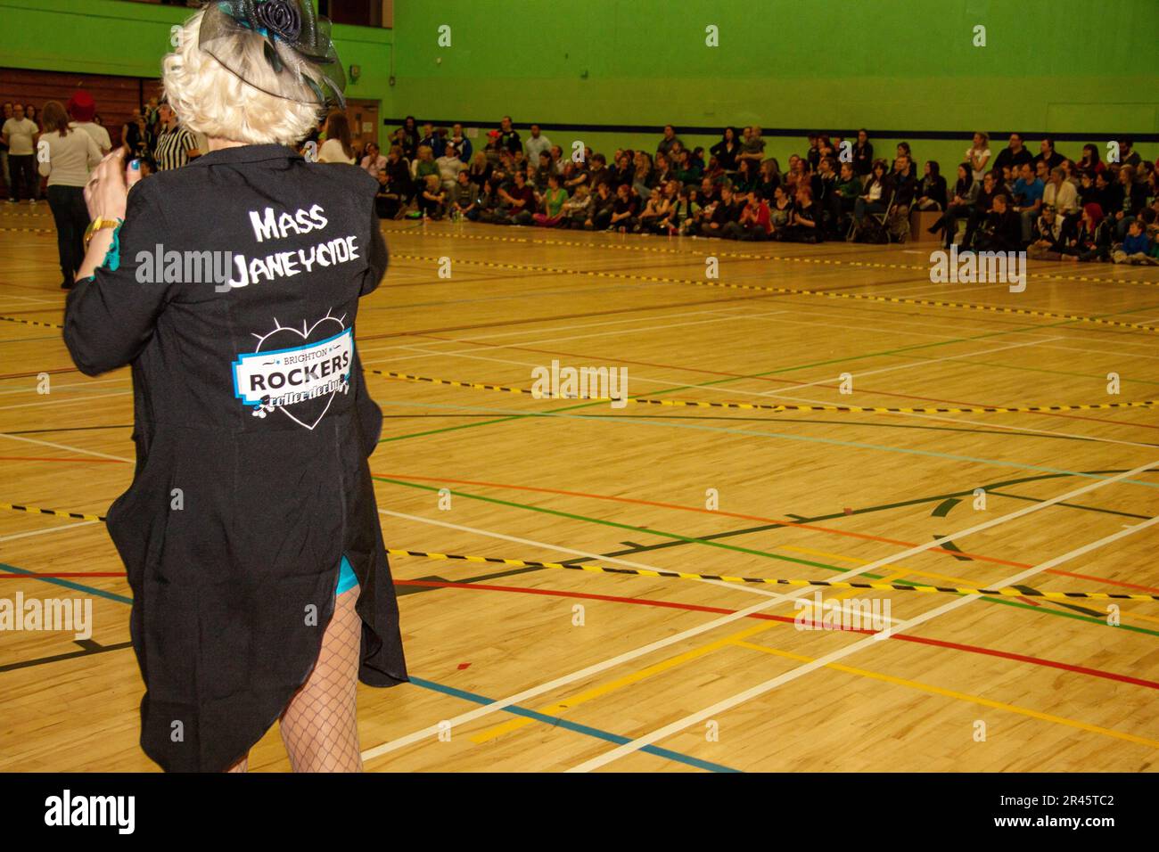 Highly involved Brighton Rockers coach Mass Janeycide at a roller derby bout in the Kelsey Kerridge sports centre Cambridge Stock Photo