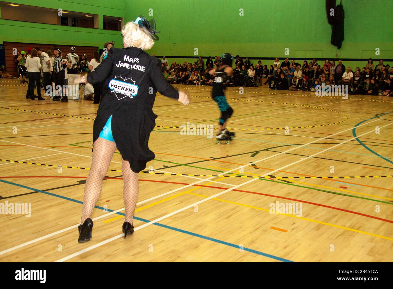 Highly involved Brighton Rockers coach Mass Janeycide at a roller derby bout in the Kelsey Kerridge sports centre Cambridge Stock Photo