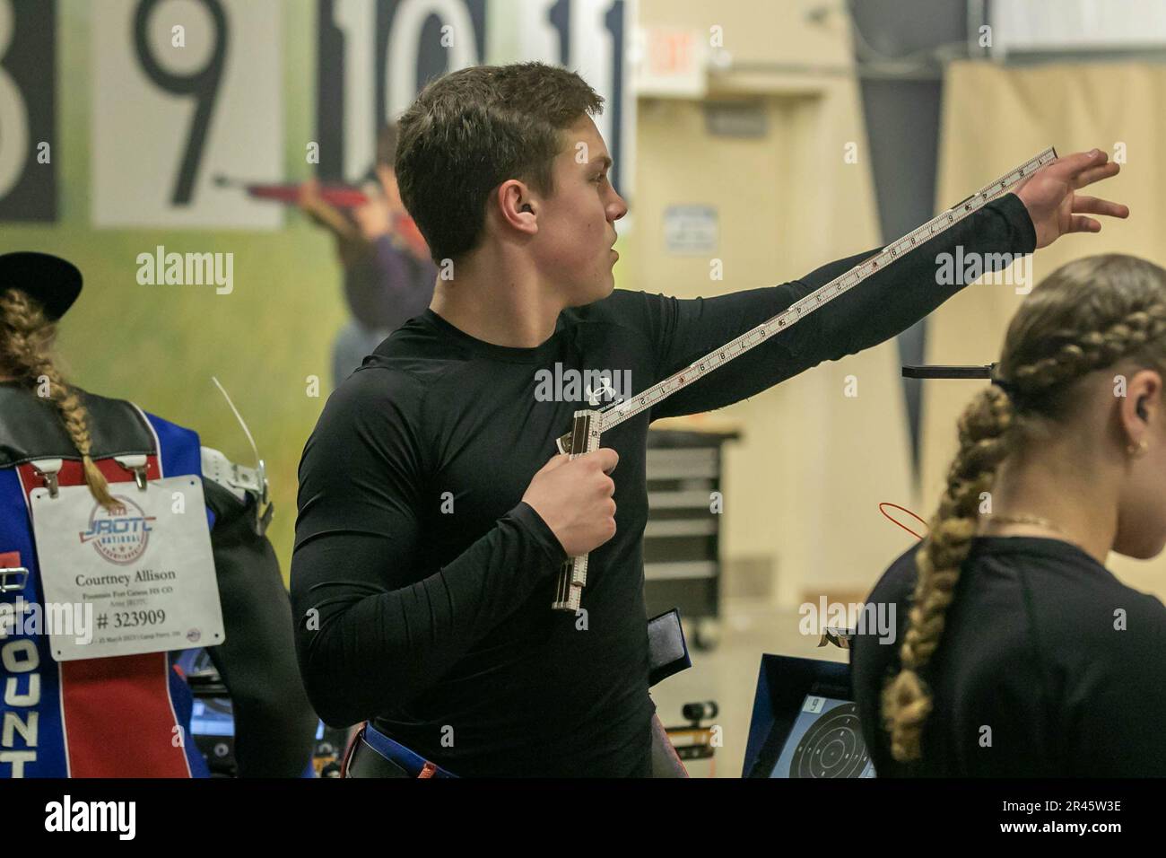 Caden Cavanaugh, an Army JROTC Cadet from Fountain-Fort Carson High School, uses a measuring tool to help establish his stance during the 2023 JROTC National Air Rifle Championship on March 25 at Camp Perry, Ohio. The competition is held March 23-25 and features the best marksmen from all-service JROTC programs across the country competing in sporter and precision shooting events. | Photo by Sarah Windmueller, U.S. Army Cadet Command Public Affairs Stock Photo