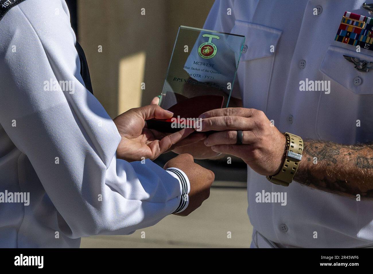 U.S. Navy Petty Officer Second Class Rashida Plummer, left, a religious