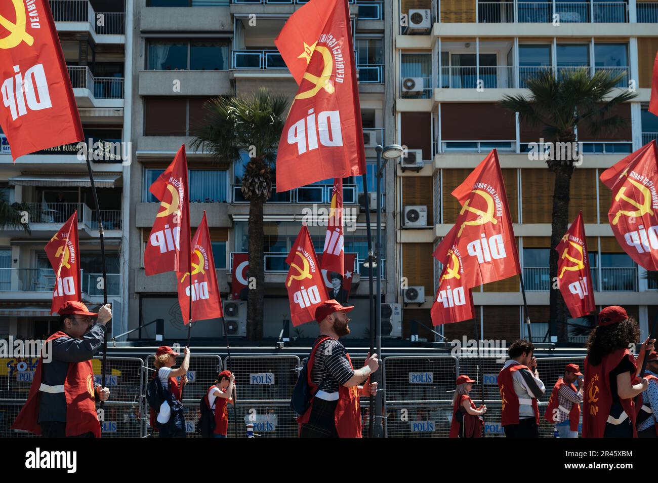 Members of the Communist Party march on the street. Members of the Unions, civil associations, supporters of the opposition parties and the pro-Kurdish parties HPD and Yesil Sol Party, gathered at Gundogdu Square in Izmir to celebrate the International Workers' Day on May 1st, and the country is set to vote on May 14th, people attending the gathering were also expressing their political support for the opposition parties. Stock Photo