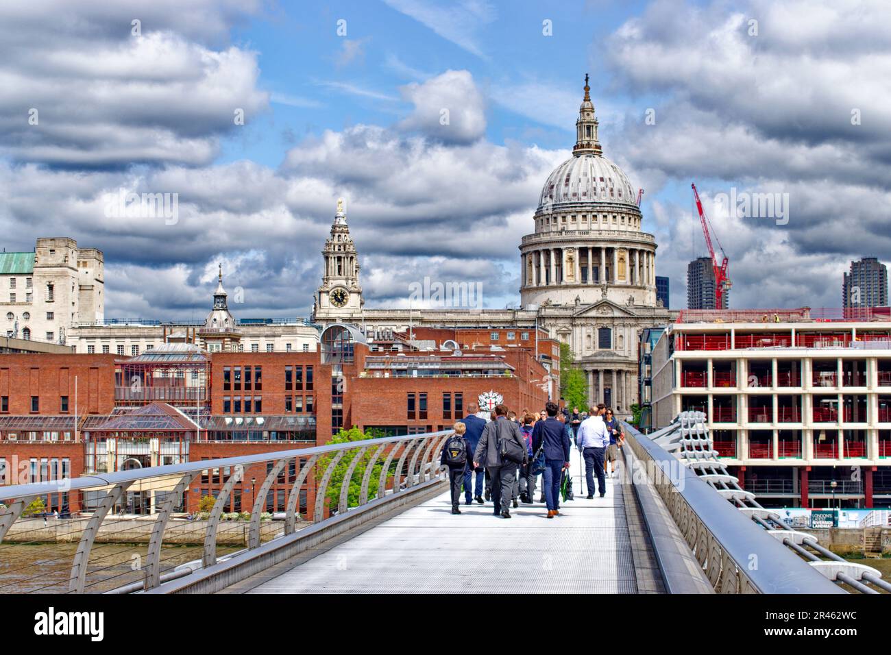London St Pauls Cathedral the Millennium Footbridge City of London School and cranes and new buildings Stock Photo