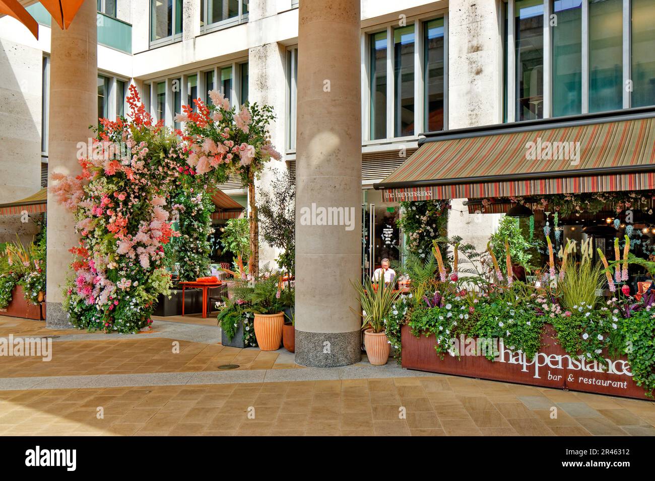London St Pauls Paternoster Square and flowers outside happenstance restaurant Stock Photo