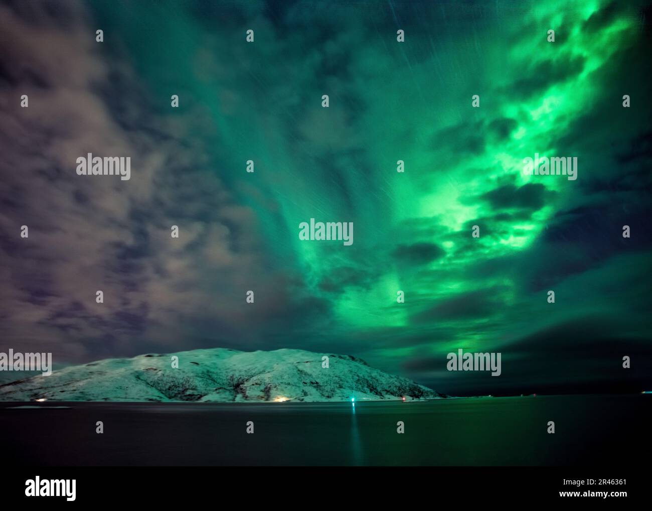 A majestic view of the Northern Lights illuminating the night sky over ...
