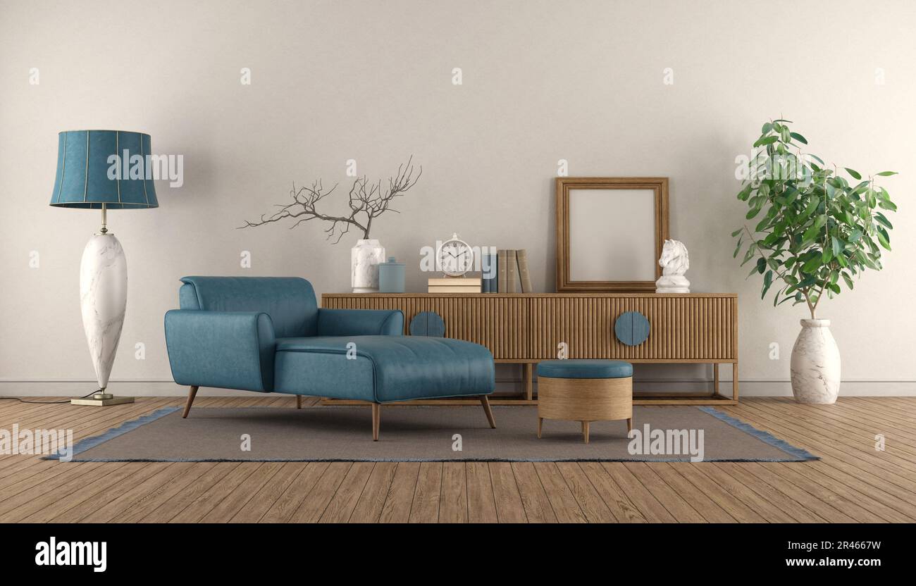 Blue chaise lounge and vintage sideboard in a white living room with