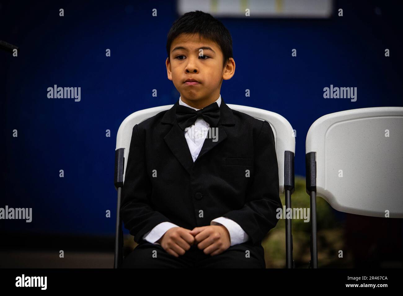 Nineyearold Donald Ungott sits quietly waiting for the Alaska Heroism