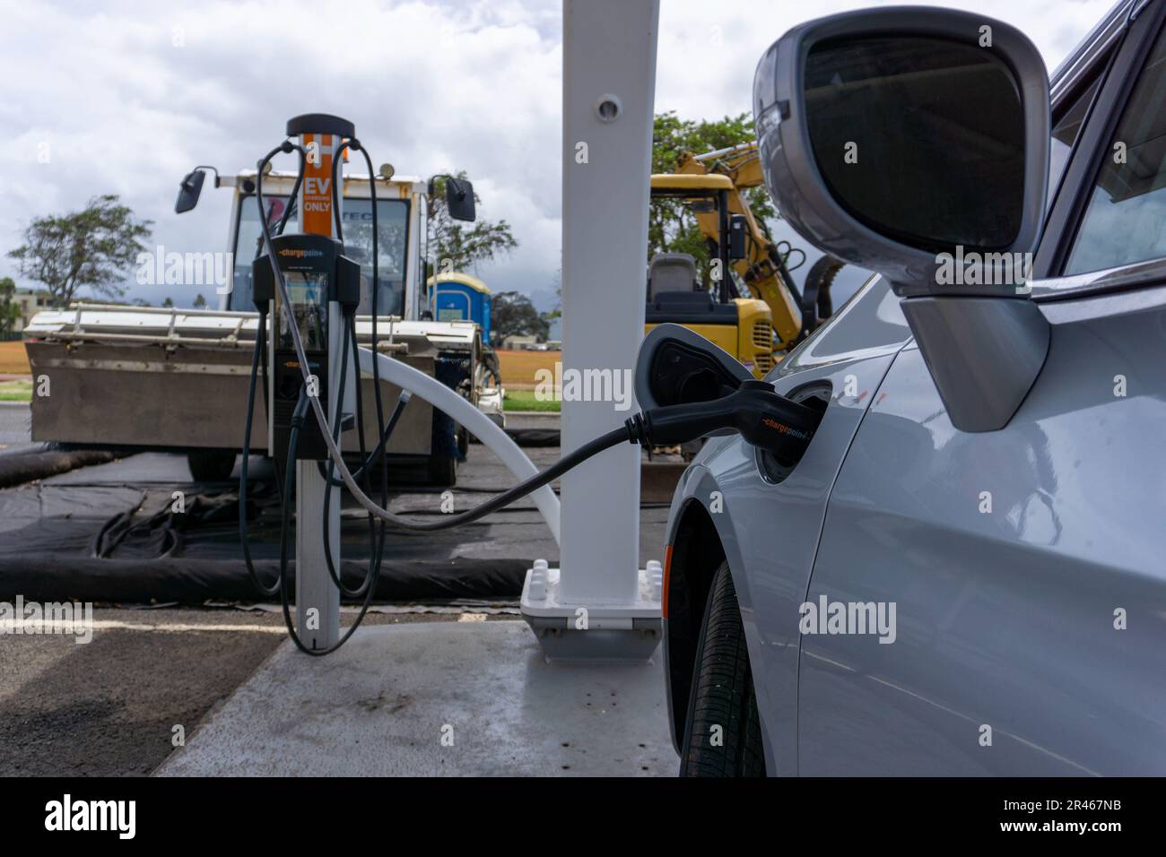 An EV ARC 2020 charging station charges a 2023 Chrysler Pacifica