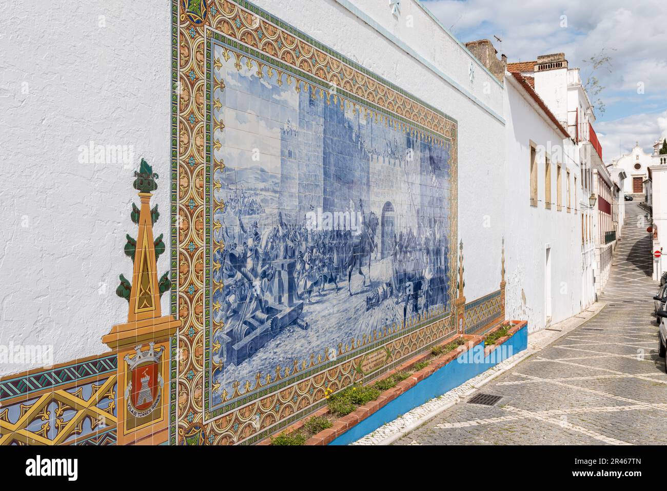 Large tile panel on the main square of Torres Novas portraying an army in front of the castle gates, Santarem, Portugal. Stock Photo