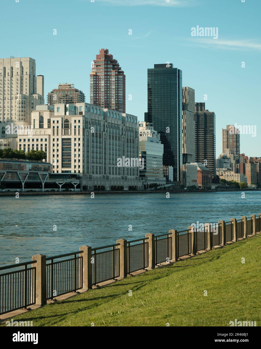 View of the East River and buildings in Manhattan from Roosevelt Island, New York City Stock Photo