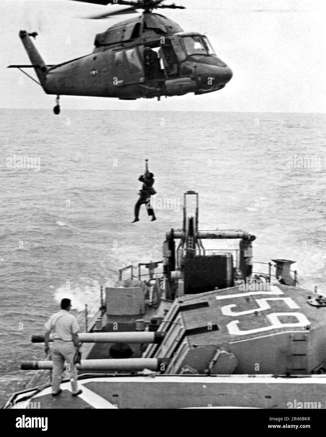 UH-2 of HC-7 lifting man from USS Lofberg (DD-759) 1970 Stock Photo - Alamy