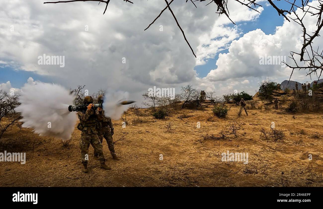 Spc. Kevin Poppe, left, and Staff Sgt. Daniel Vatterott, paratroopers from Chosen Company, 2nd Battalion, 503rd Parachute Infantry Regiment, 173rd Airborne Brigade conduct an AT4 range during exercise Justified Accord 23 (JA23) in Isiolo, Kenya, Feb. 19, 2023. JA23 is U.S. Africa Command’s largest exercise in East Africa. Led by U.S. Army Southern European Task Force, Africa (SETAF-AF), this multinational exercise brings together more than 20 countries from four continents to increase partner readiness for peacekeeping missions, crisis response and humanitarian assistance. Stock Photo