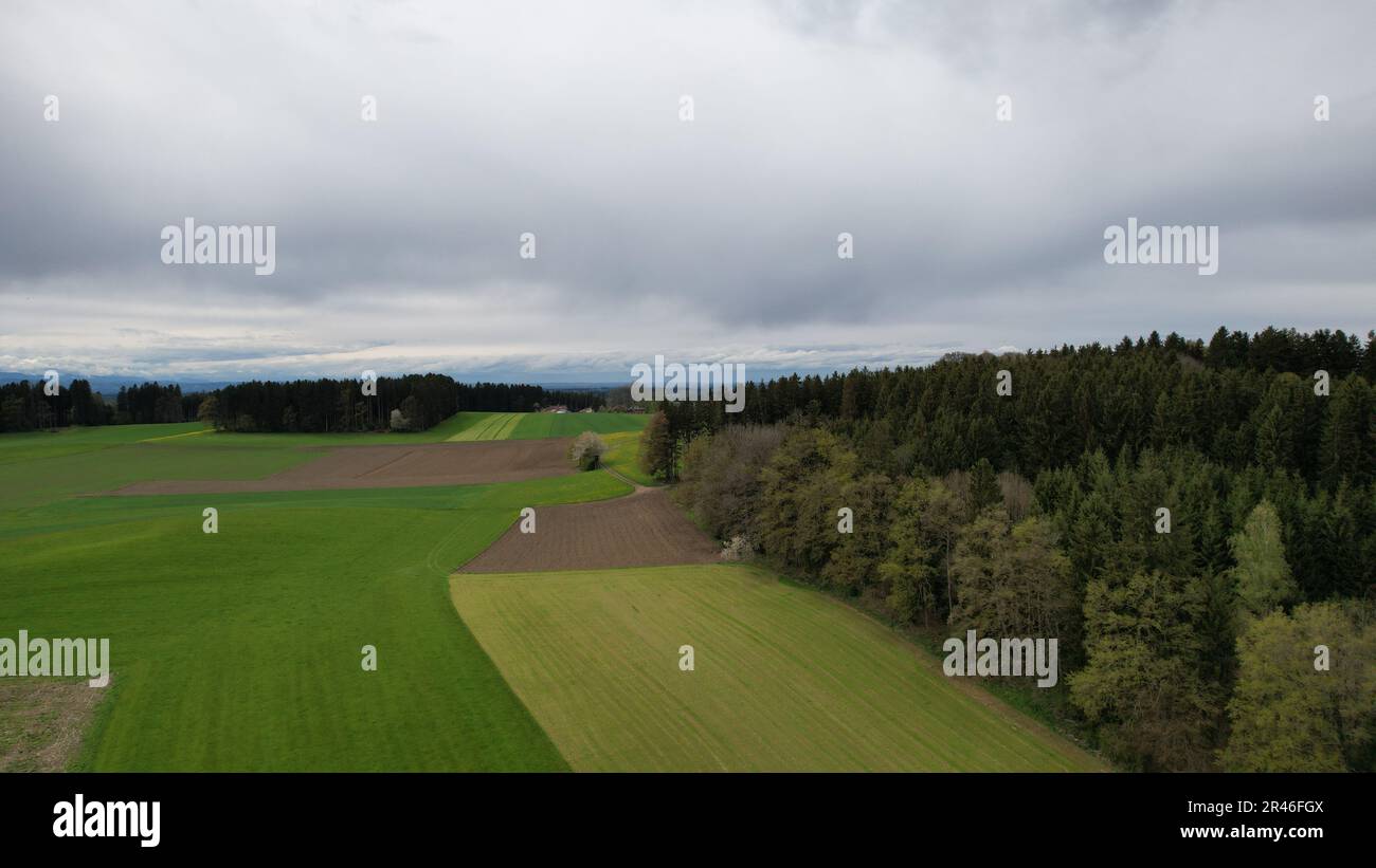 An aerial view of a scenic landscape with lush green trees set against ...