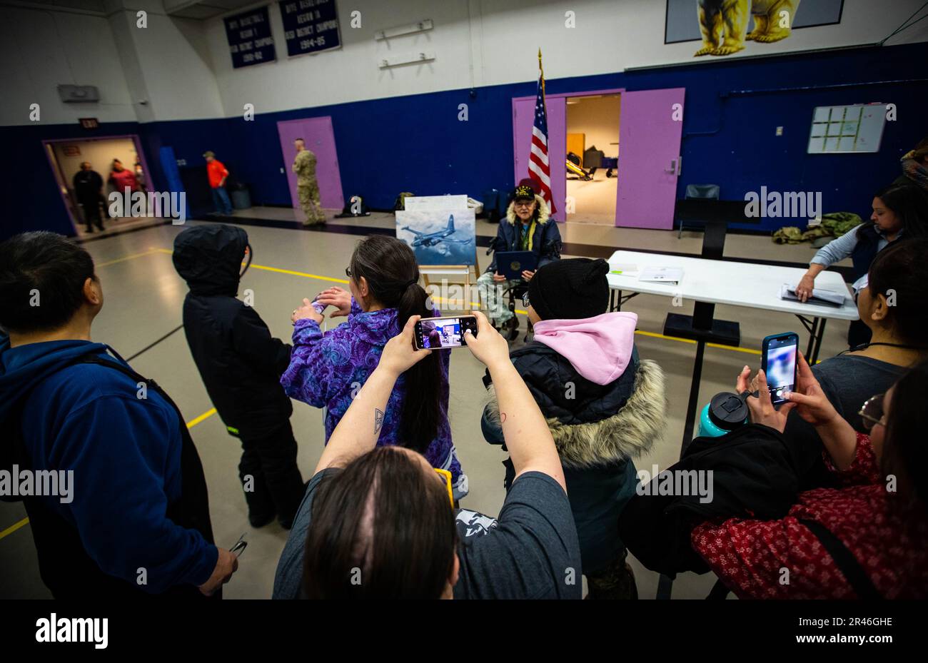 Family and friends take pictures of Alaska Heroism Medal recipient Cpl