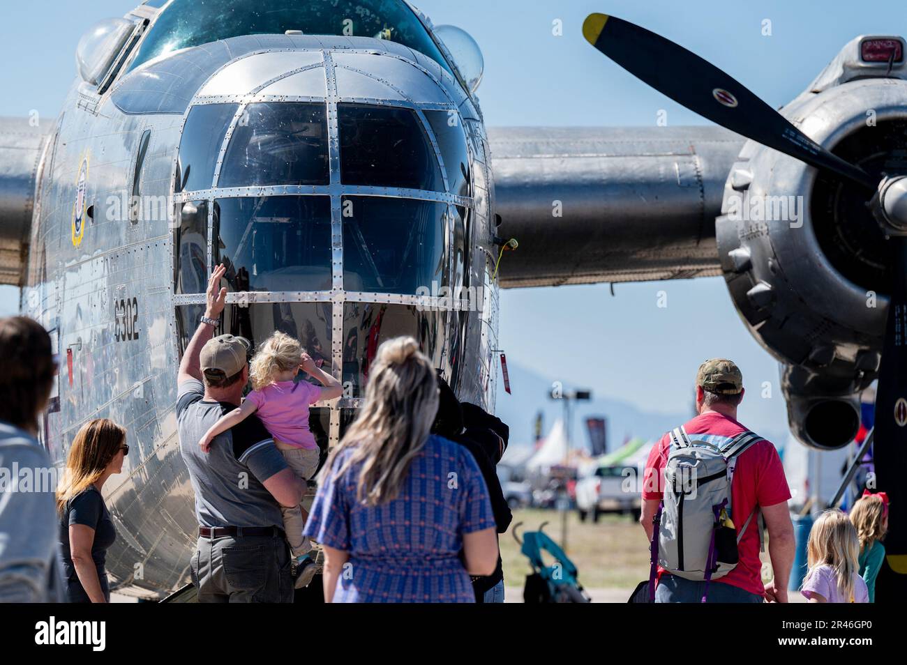 Air show attendees look at an aircraft static display during the