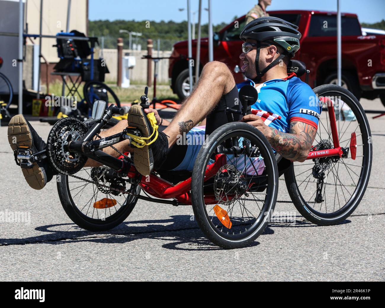 U.S. Army Sgt. Kevin Reyes, smiles while doing warmups for cycling during the U.S. Army Adaptive Sports Camp at Fort Bragg, North Carolina, April 2, 2023. Over 70 wounded, ill and injured Soldiers are training in a series of athletic events including archery, cycling, shooting, sitting volleyball, swimming, powerlifting, track, field, rowing, and wheelchair basketball. The Adaptive Sports Camp celebrates wounded, ill, and injured Soldiers ability to recover and overcome. The Army Holds qualifying trials for Active Duty, wounded, ill, or injured Soldiers to assess and select athletes for compet Stock Photo