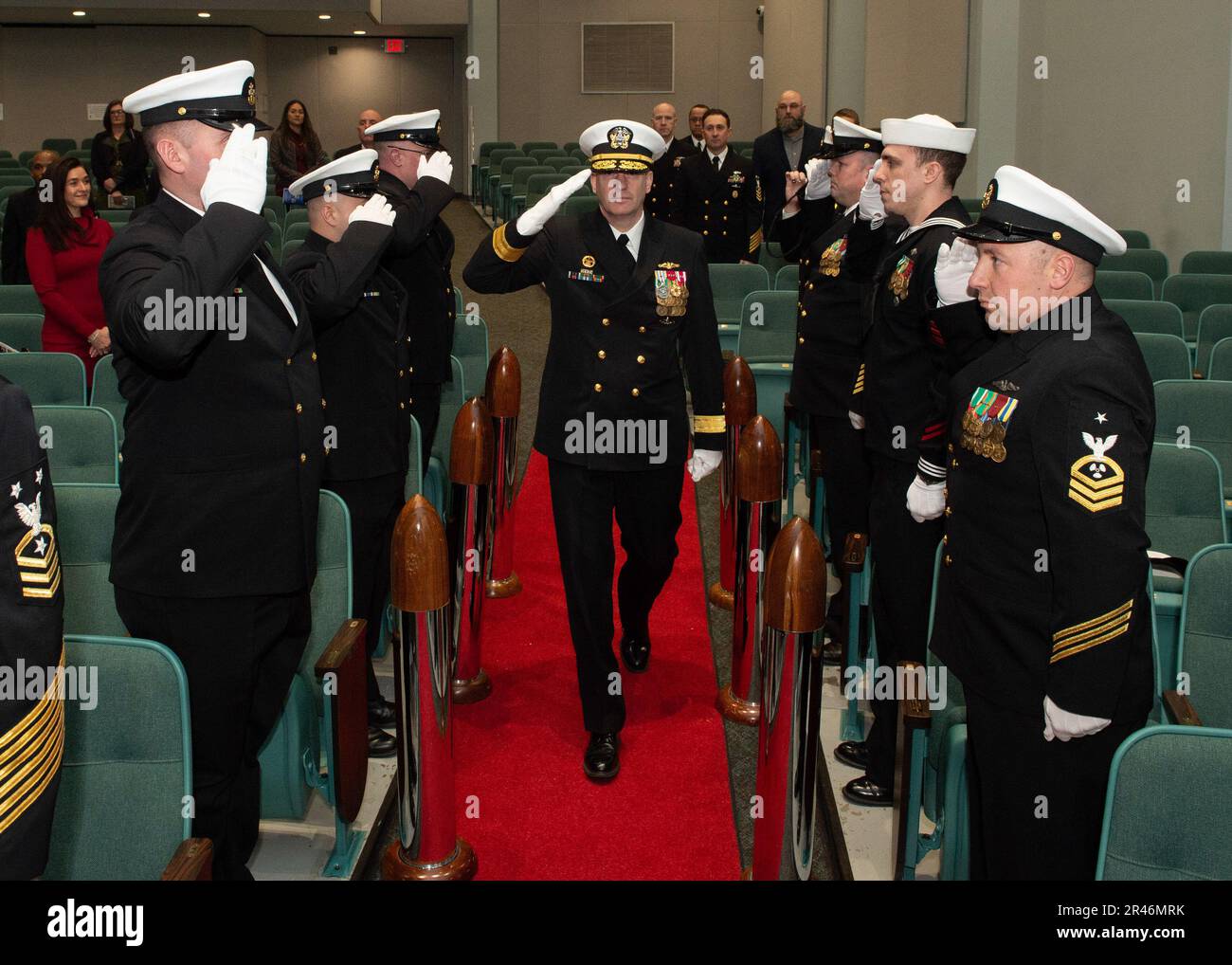 230324 -N-ED185-3065 KEYPORT, Wash. (March 24, 2023) – Rear Adm. Mark Behning, commander, Submarine Group 9, passes through sideboys during a change of command ceremony for Commander, Submarine Squadron 19 (COMSUBRON 19).  Capt. Dale Klein relieved Capt. Sean Huey as commodore of COMSUBRON 19. Stock Photo