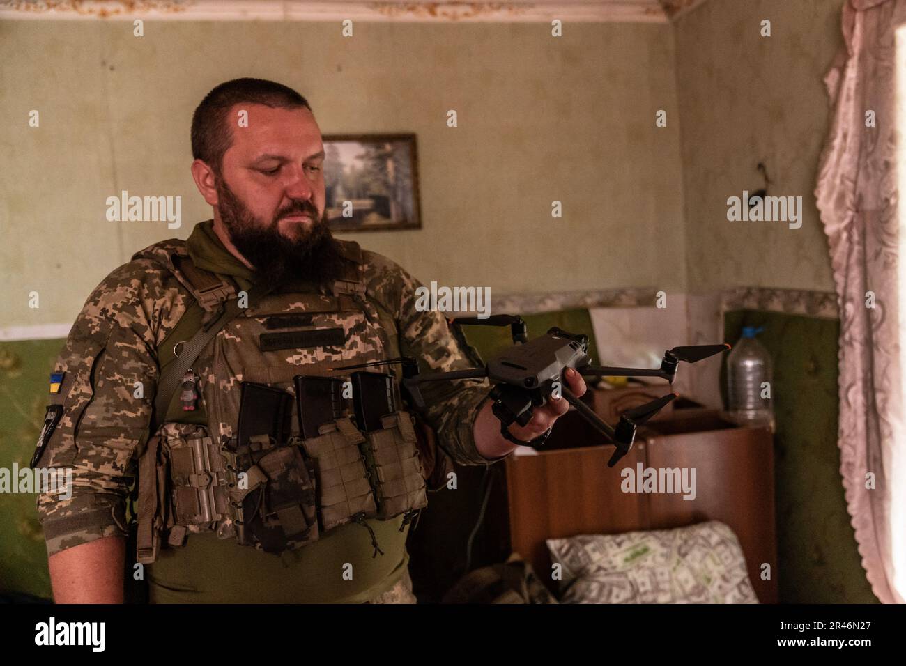 Pavlo, Member of Special Ukrainian army unit of drones displays DJI Mavic 3 drone to reconnaissance positions of Russian forces using Starlink technology in undisclosed location in Donbas of Ukraine on May 26, 2023 Stock Photo