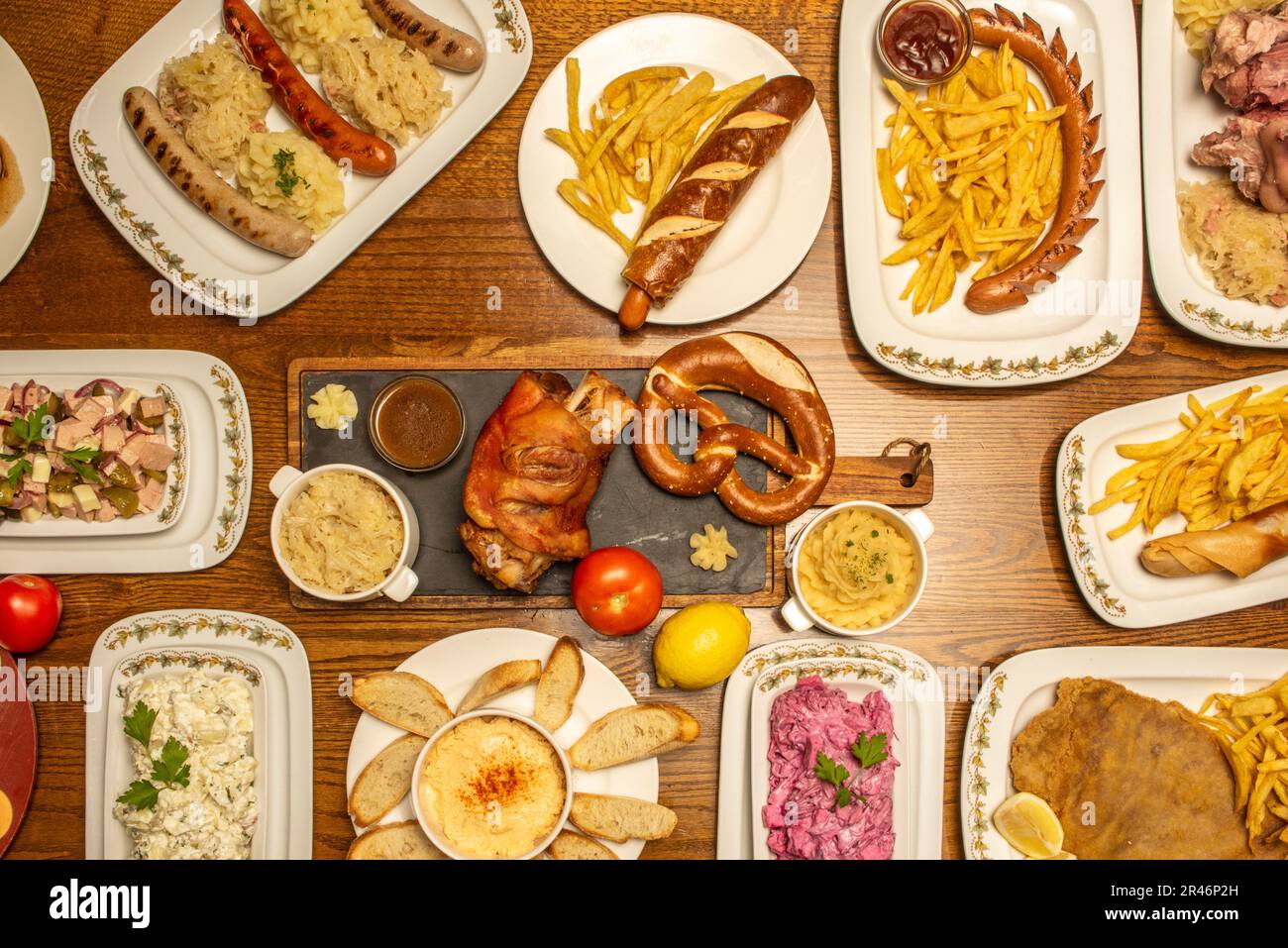 Set of assorted German food dishes with fried knuckle, sausages, stews