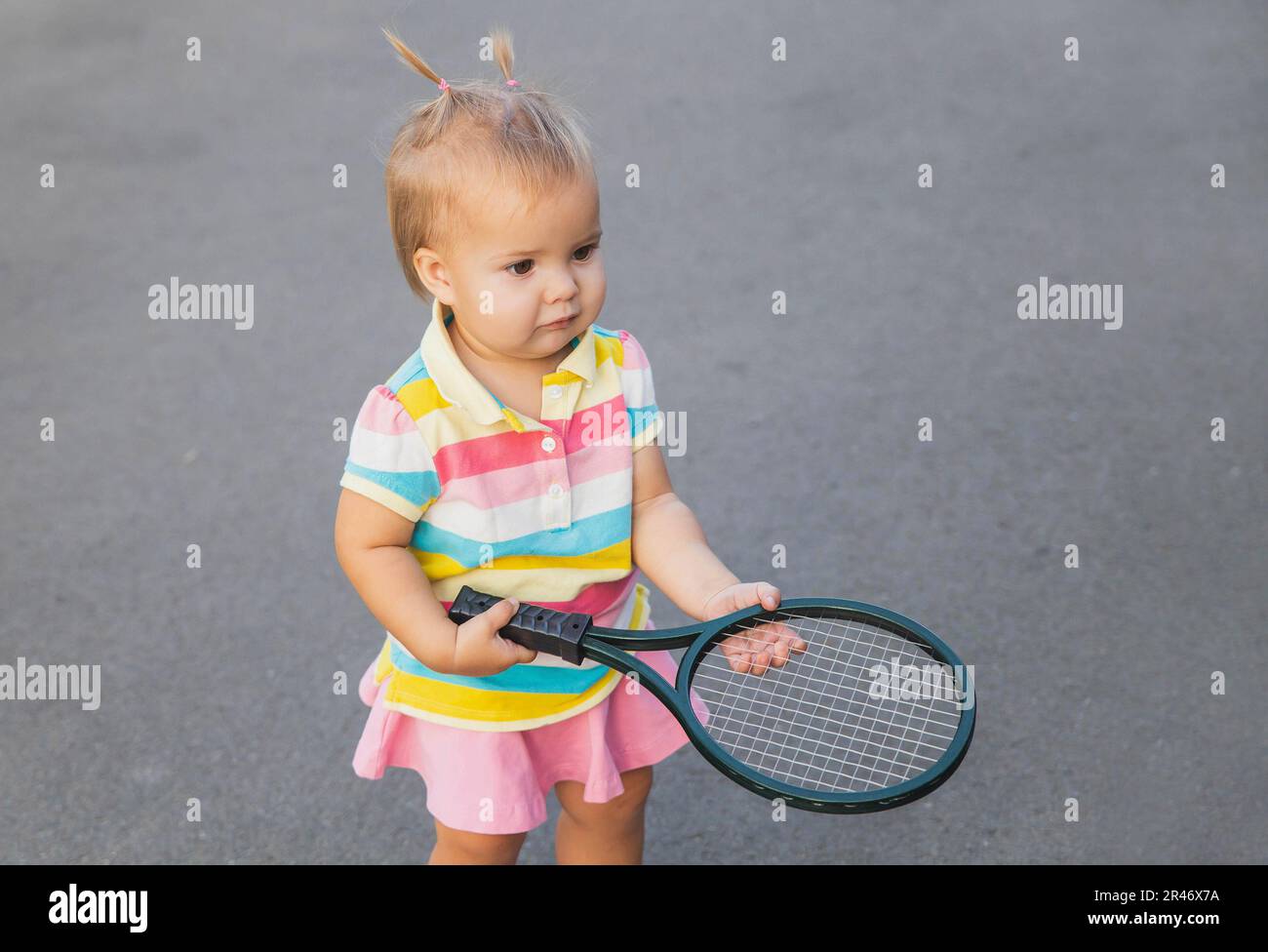 Little Tennis Rackets charming little tennis player with a racket Stock Photo - Alamy
