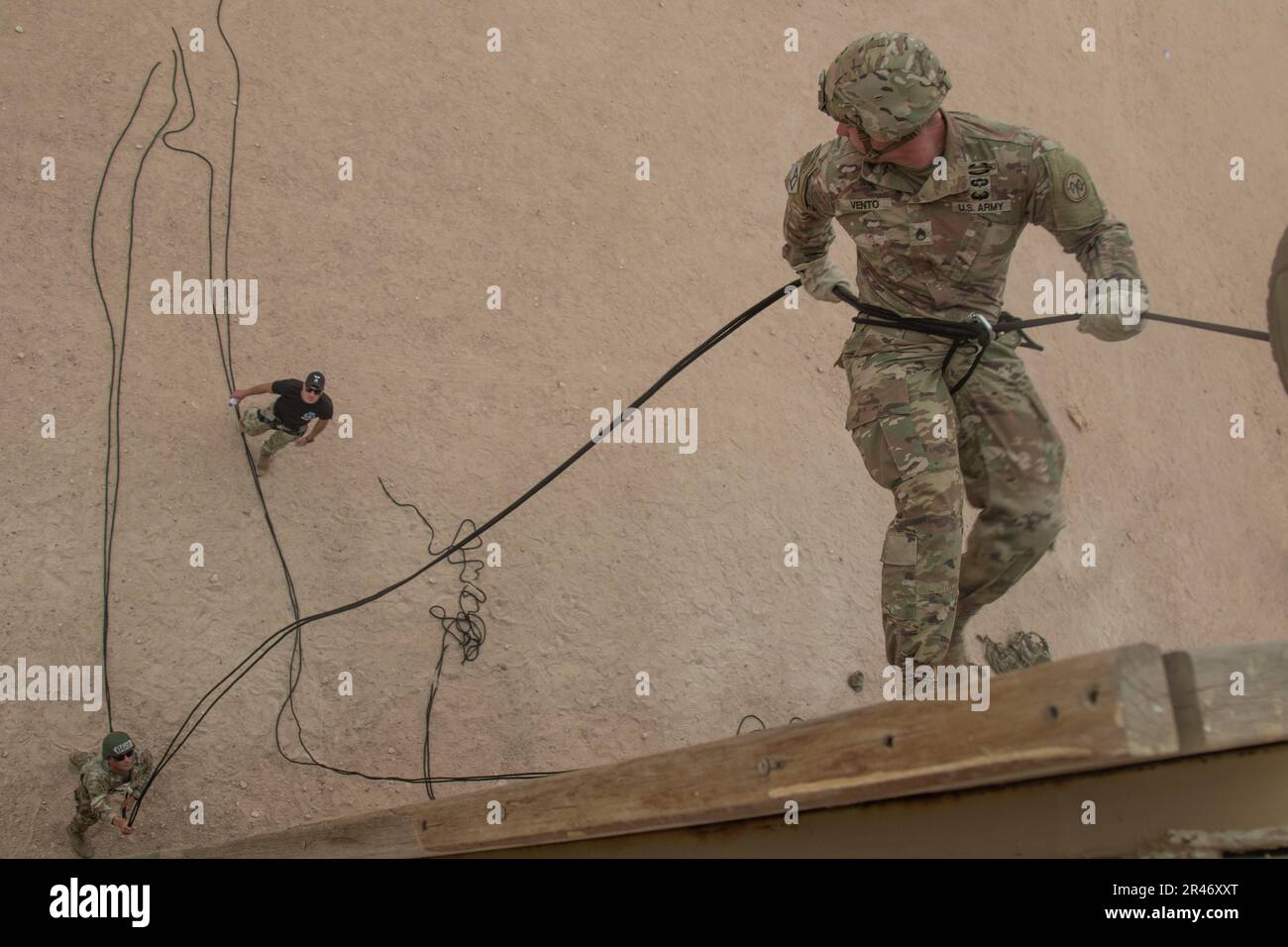 A Soldier from Task Force Spartan descends down from the top of the ...