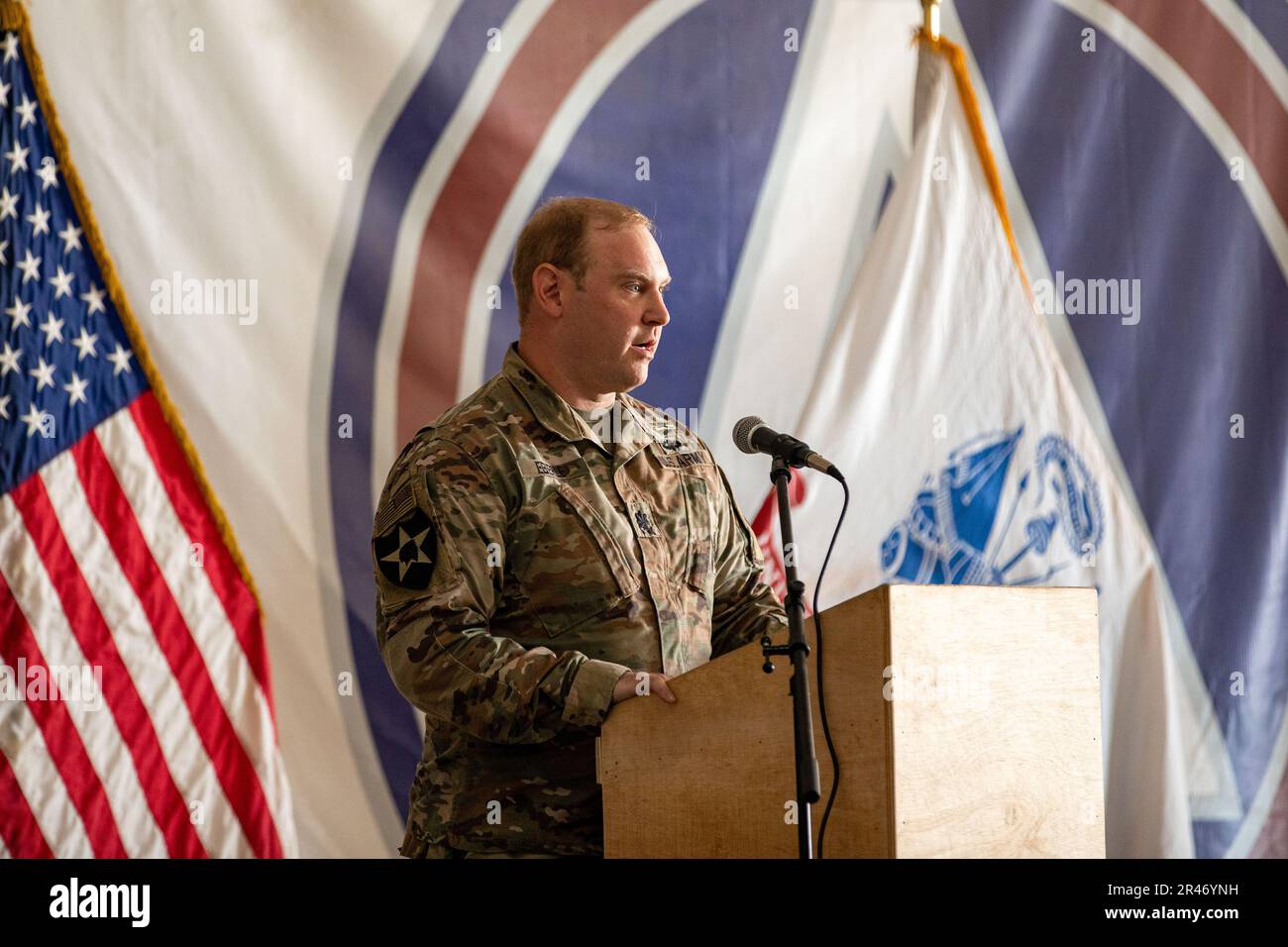 U.S. Army Lt. Col. Scott Eberle, the commander of the 382nd Combat Sustainment Support Battalion, speaks to the attendees during a ceremony in which the 336th CSSB transferred authority to the 382nd CSSB. These battalions are subordinate to the 369th Sustainment Brigade while forward deployed to the CENTCOM area of operations. Stock Photo