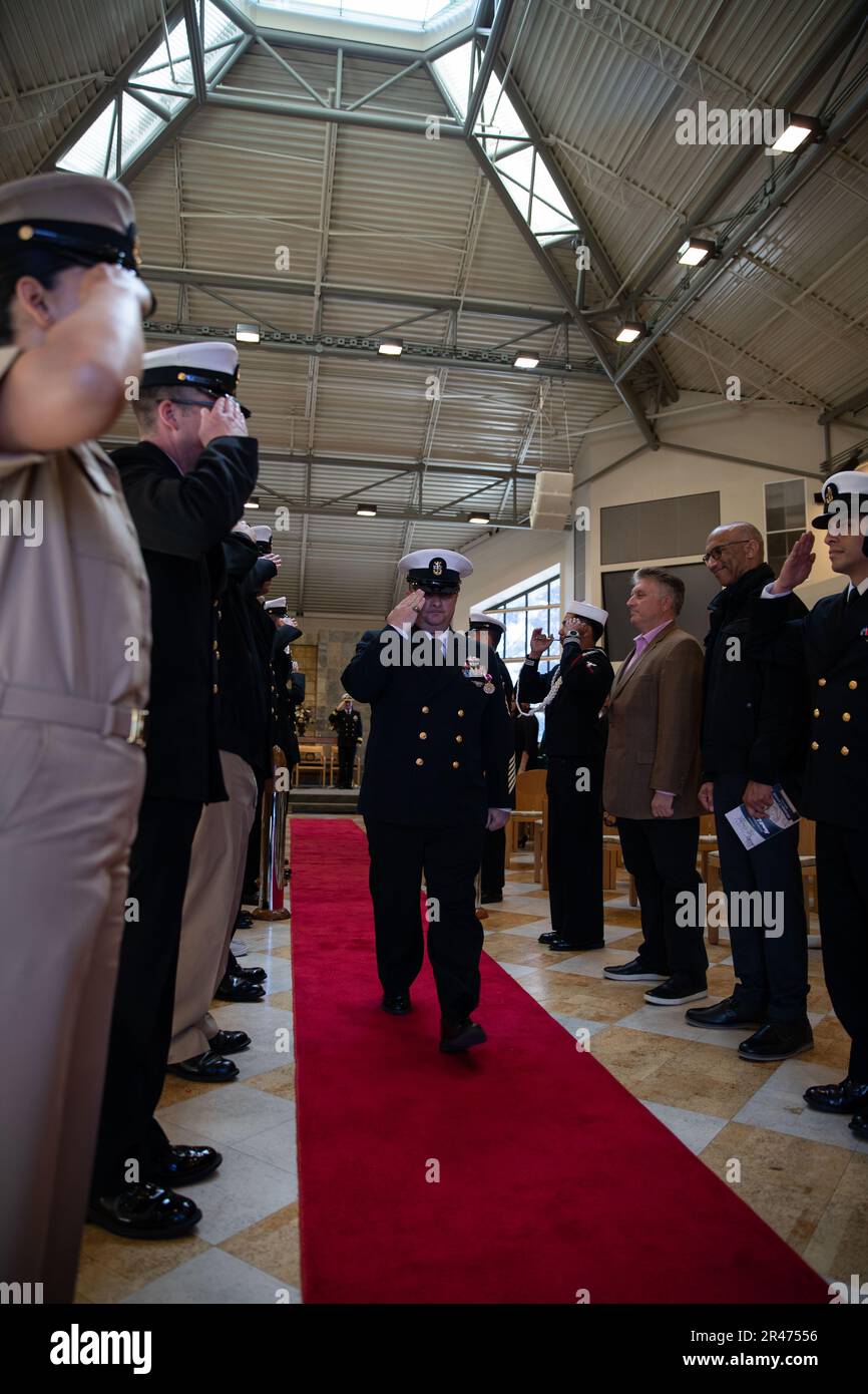 230331-N-XP477-1445 SAN DIEGO (March 31, 2023) – Master Chief Operations Specialist Kermit L. Pollard, center, returns a salute while being piped ashore during his retirement ceremony at the Murphy Canyon Chapel, March 31, 2023. Pollard is retiring after 27 years of dedicated service to the U.S. Navy. Stock Photo