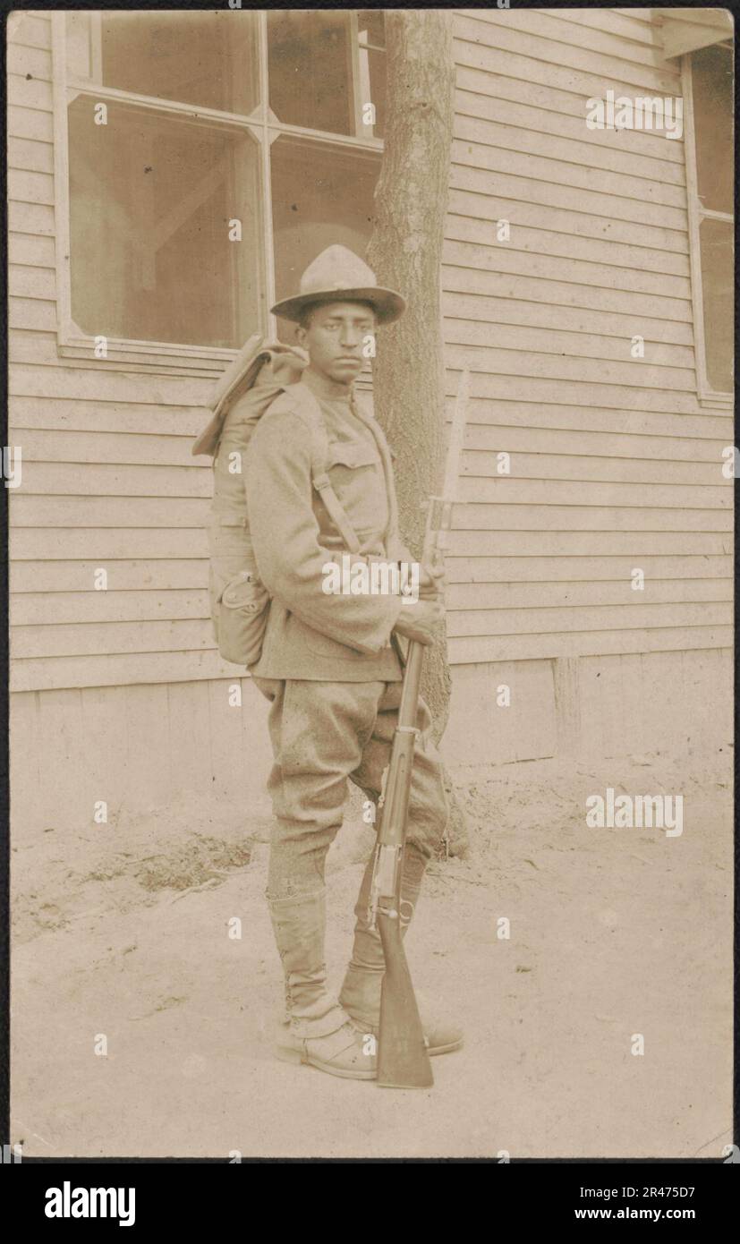 Unidentified African American soldier in uniform, cartridge belt, and ...
