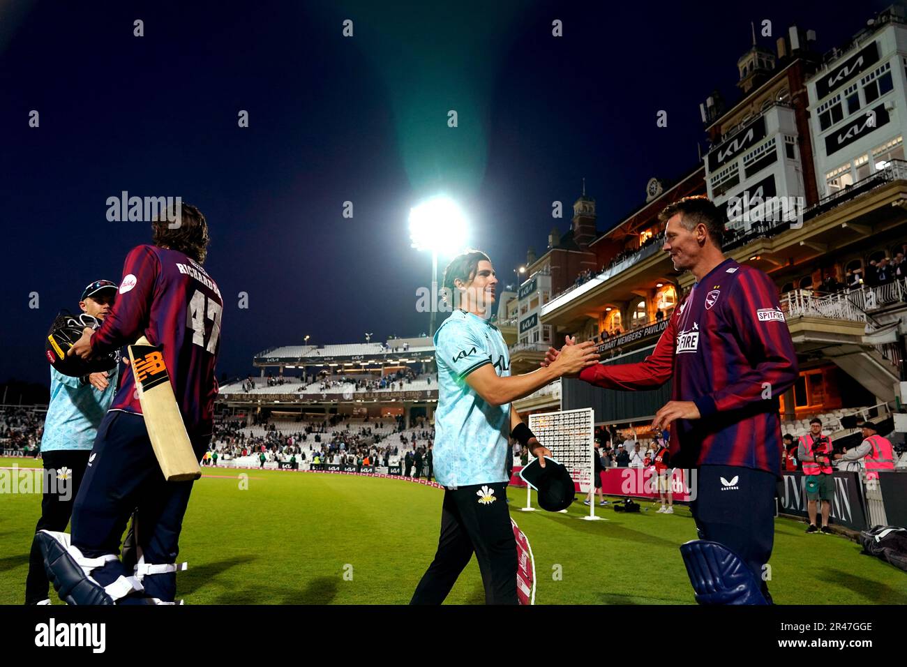 Surrey’s Sean Abbott (centre) is congratulated at the end of the match on their victory during the Vitality Blast T20 match at the Kia Oval, London Picture date: Friday May 26, 2022. Stock Photo