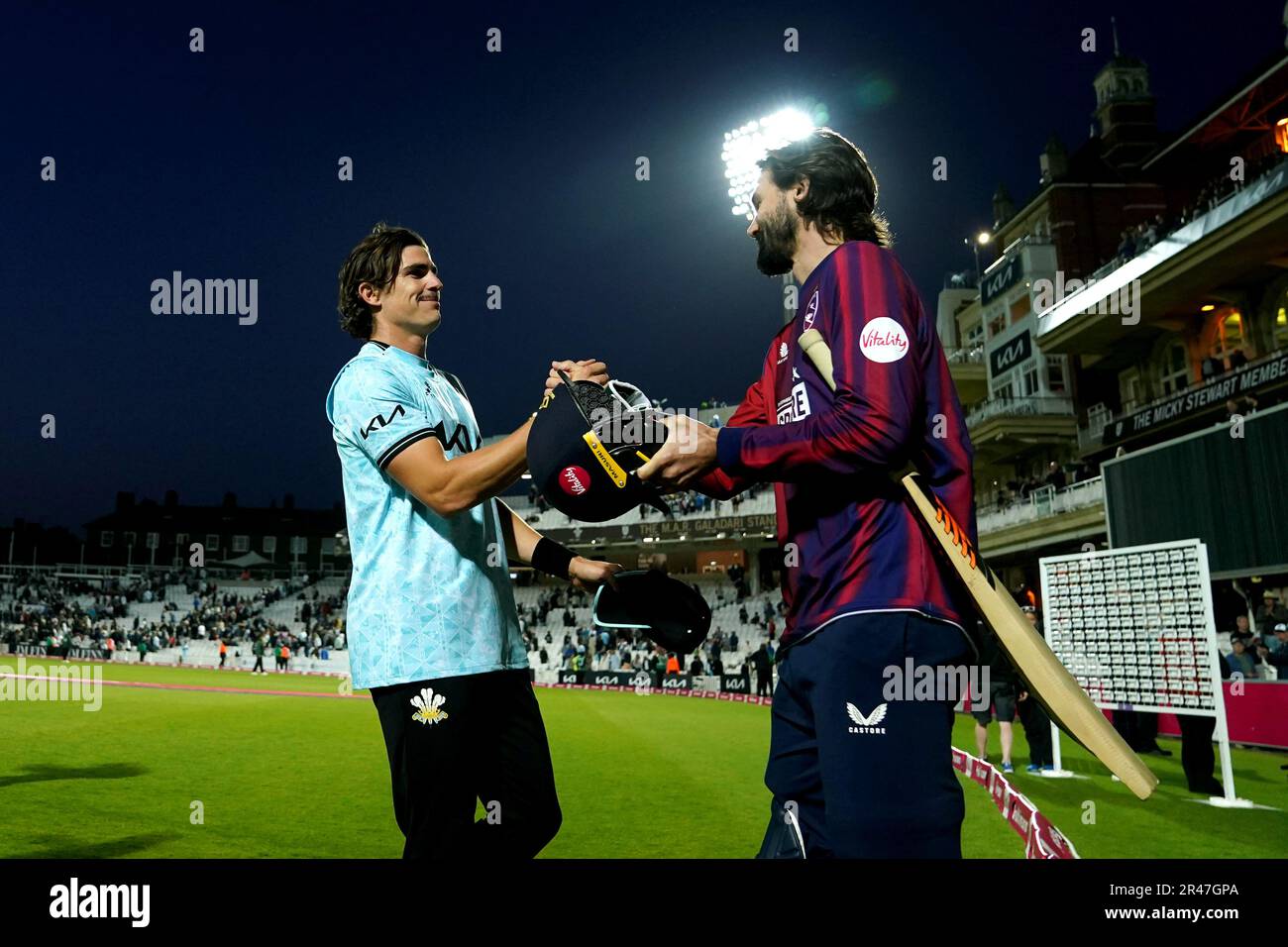 Surrey’s Sean Abbott (left) is congratulated on their victory at the end of the match by Kent Spitfire’s Kane Richardson (right) during the Vitality Blast T20 match at the Kia Oval, London Picture date: Friday May 26, 2022. Stock Photo