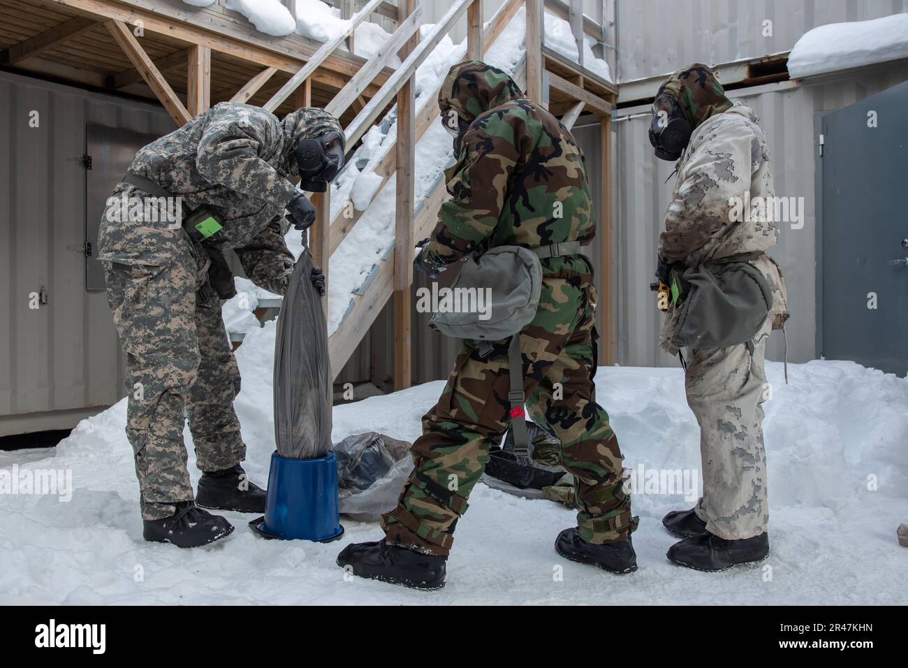 U.S. Marines with 2d Combat Engineer Battalion, 2d Marine Division, remove unexploded ordnance during a simulated chemical, biological, radiological and nuclear scenario in Setermoen, Norway March 24, 2023. Cold weather CBRN training is designed to increase Marines confidence and readiness in their abilities to combat extreme cold weather conditions. Stock Photo