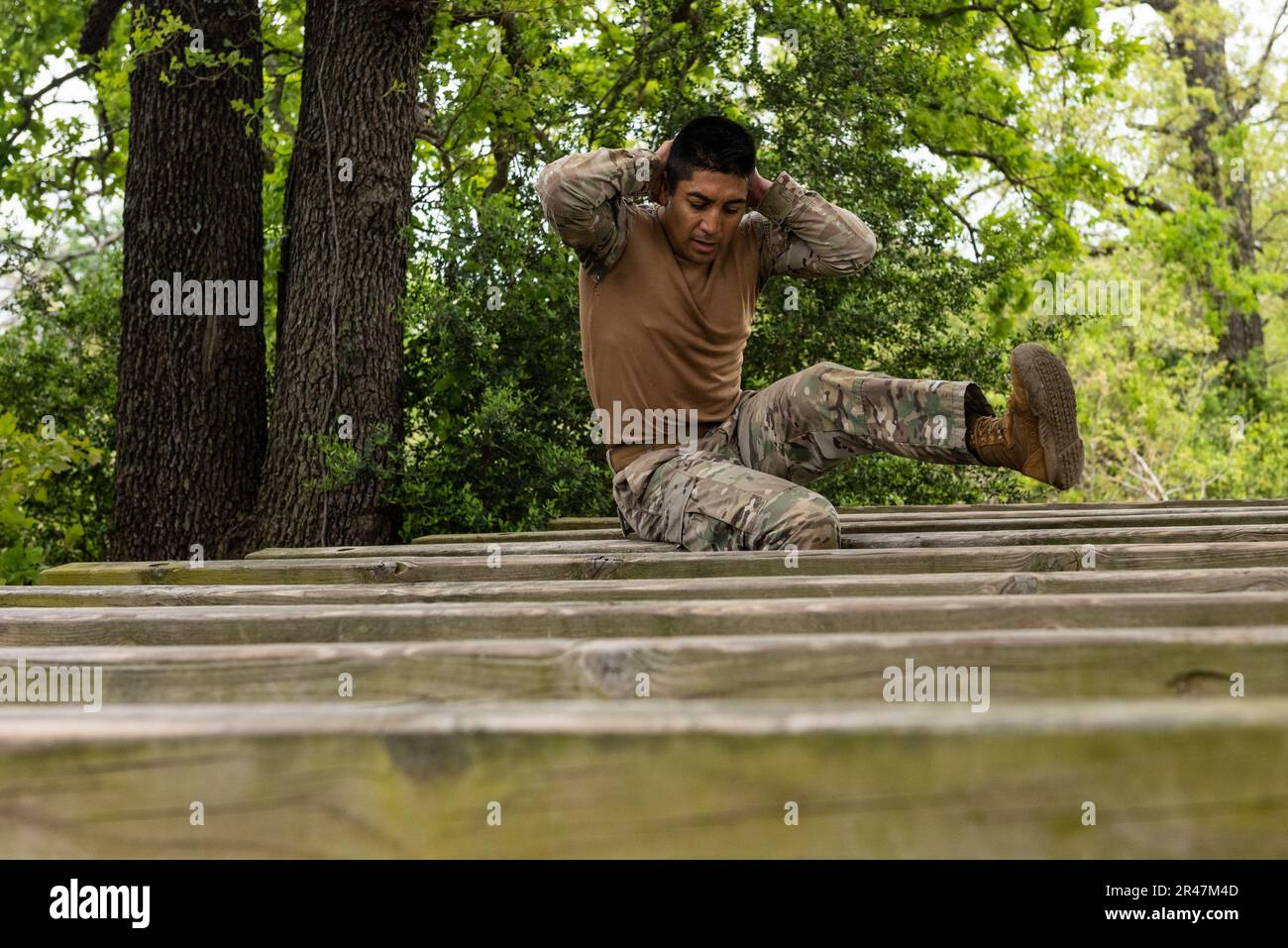 Chilean Marine Cpl. Juan Barria navigates High Step Over during the obstacle course portion of the Texas Military Department’s Best Warrior Competition at Fort Hood on Mar. 30, 2023. The TMD invites service members from its partner nations to participate in the friendly, six-day challenge. The partnership is part of the National Guard Bureau’s State Partnership Program, which pairs National Guards from every state and U.S. territories with partner nations to increase regional security and advance U.S. interests. The program has been successfully building relations for 30 years and now includes Stock Photo