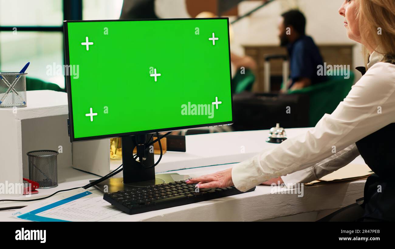 Receptionist Screen Receptionist using greenscreen pc Stock Photo - Alamy