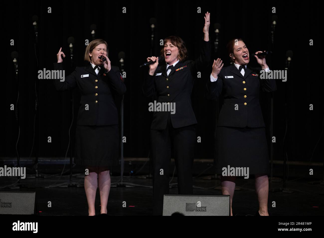 230329-N-PG545-1236, Prescott, Arizona (March 29, 2023) Musicians 1st Class Madilyn Crossland, Maia Rodriguez, and Michaela Swan, perform during a U.S. Navy Band Sea Chanters concert at Yavapai College Performing Arts Center. The Sea Chanters performed 19 concerts over 22 days, covering 2800 ground miles throughout Washington, Oregon, California and Arizona during their 2023 national tour.   National tours allow the band to connect with communities in areas of the country that do not have opportunities to see the Navy’s premier musical ensembles on a regular basis, and to honor those who have Stock Photo