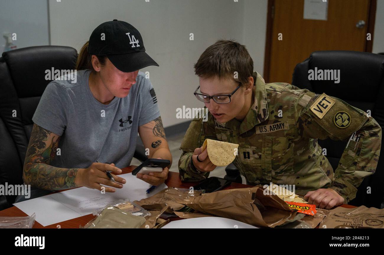 U.S. Army Soldiers Sgt Shaylee Ramirez and Capt. Victoria Hammer from the  109th Medical Detachment Veteran Support Squadron test Meals Ready to Eat  for quality and freshness at Ali Al Salem Air