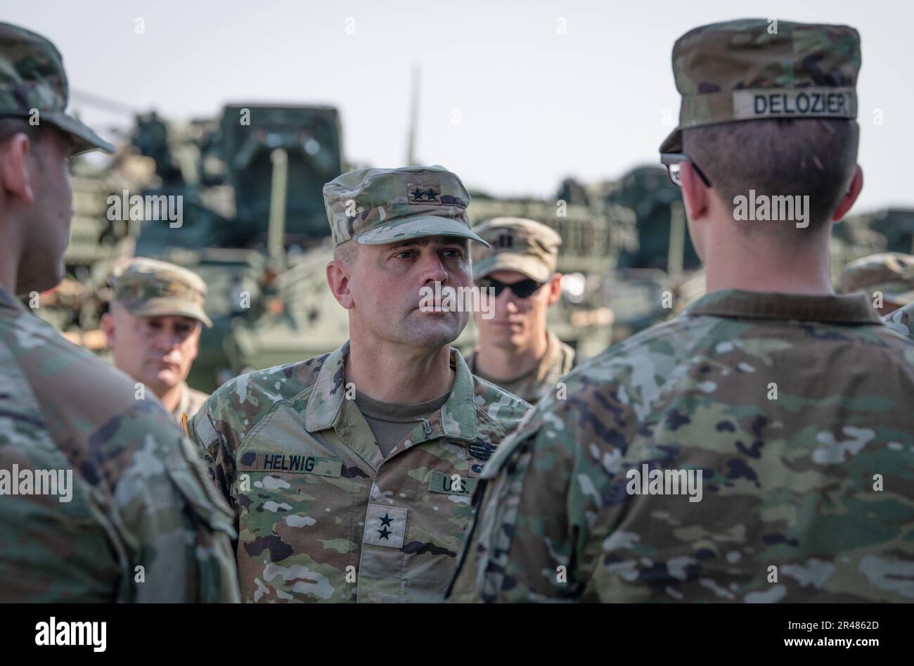 U.S. Army Maj. Gen. Jered Helwig, commander of the 8th Theater Sustainment Command, receives a report from 1st Lt. Jonathan DeLosier, 3rd Stryker Brigade Combat Team, 2nd Infantry Division, during exercise Cobra Gold 2023 at Lop Buri, Thailand, March 1, 2023. Exercises like Cobra Gold prepare the U.S. and Thailand to work together more effectively in times of need by allowing U.S. Army Civilians and Soldiers to practice logistical movements. Cobra Gold, now in its 42nd year, is a Thai-U.S. co-sponsored training event that builds on the longstanding friendship between the two allied nations and Stock Photo