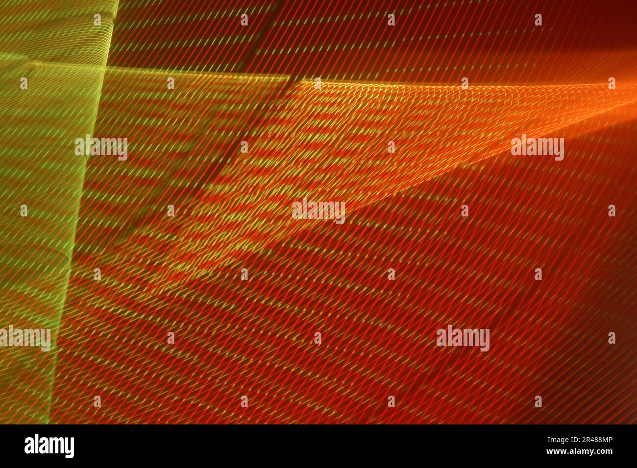 A large display featuring a pattern of red lights radiating outward along distinct lines Stock Photo