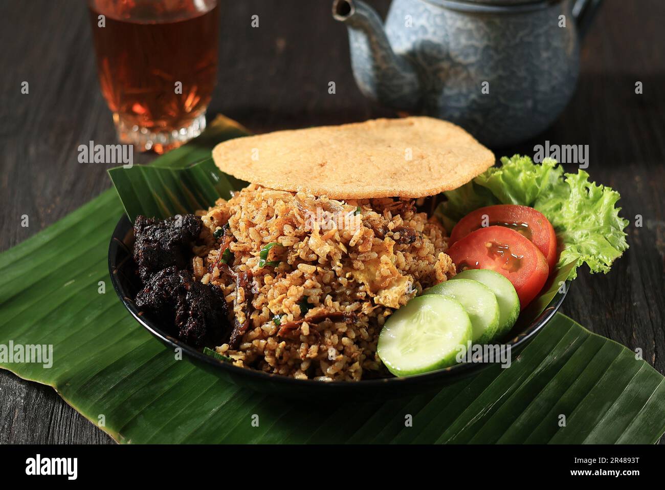 Nasi Goreng Rendang with Shrimp Cracker, Rendang is Traditional Melayu Minang Beef Stew Stock Photo