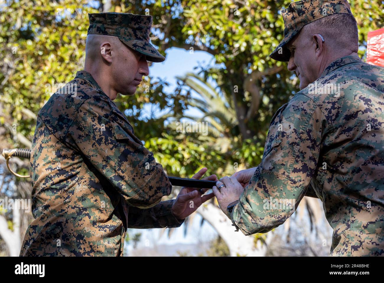 U.S. Marine Corps Sgt. Maj. Fausto H. Cabrera, left, the