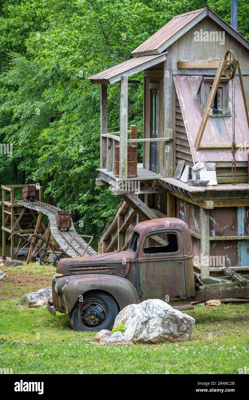 Vintage Ford pickup truck and mining props at the entrance to SharpTop Cove, a YoungLife camp in Jasper, Georgia. (USA) Stock Photo