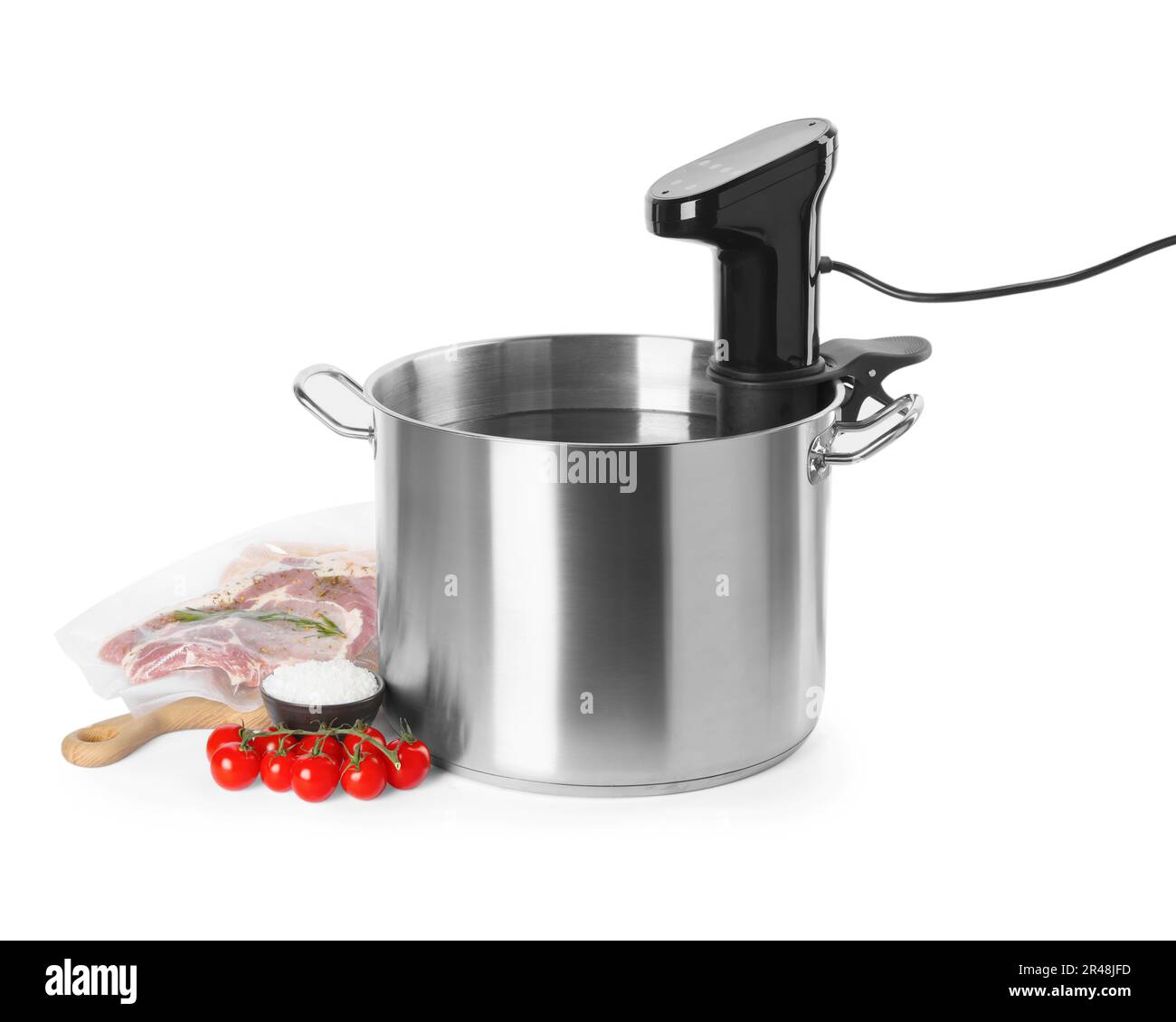 Thermal immersion circulator in pot and ingredients on white background