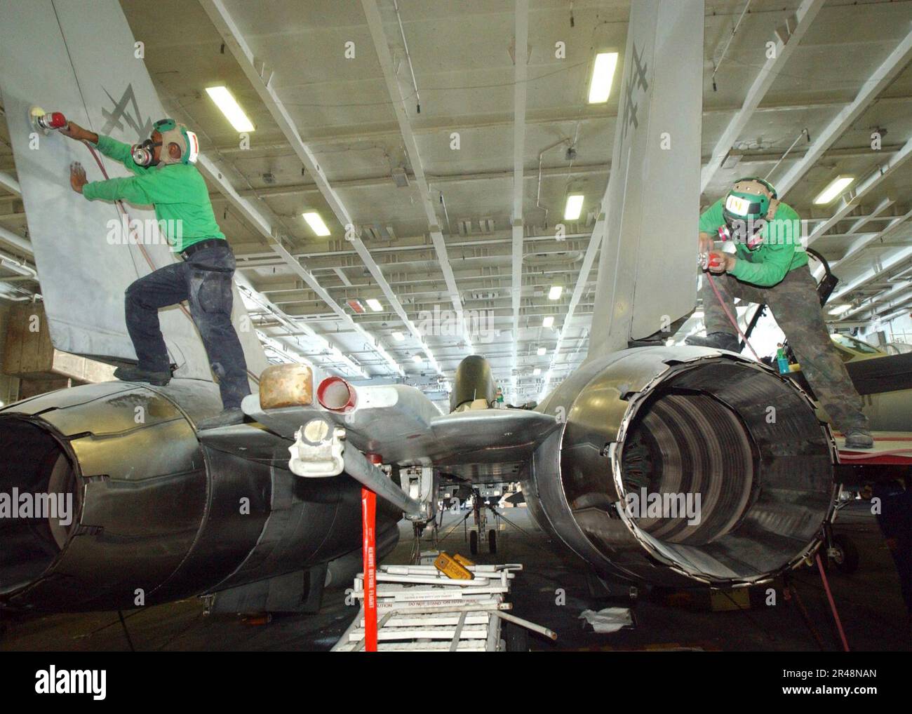 US Navy F-14 maintenance in ship's hangar bay Stock Photo - Alamy