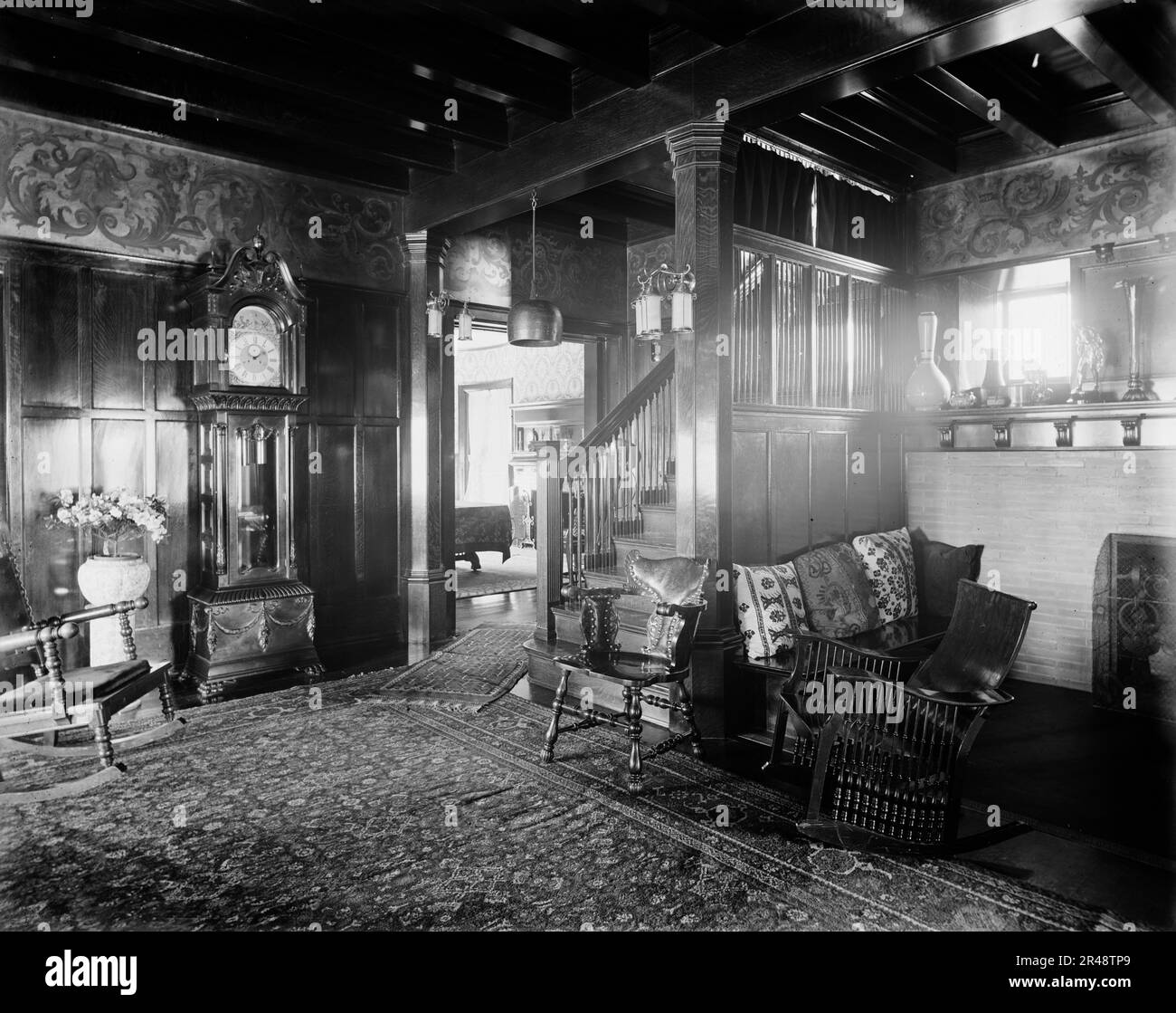 Residence of Dr. J.H. Lancashire, the hall and grandfather clock, Alma, Mich., between 1900 and 1910. Stock Photo