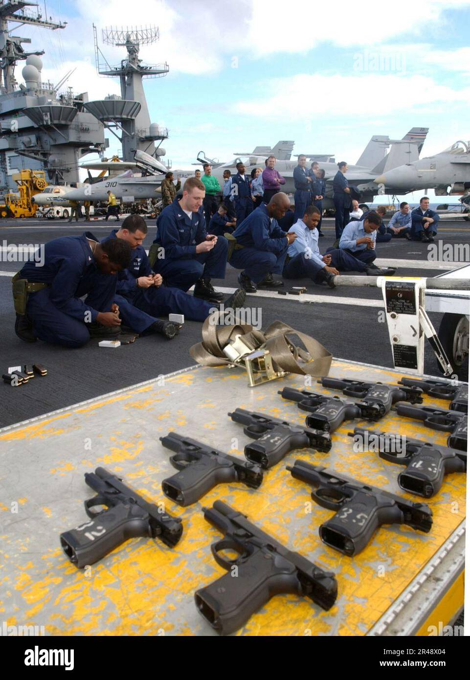 US Navy Gunner's Mates train and supervise handgun qualifications on