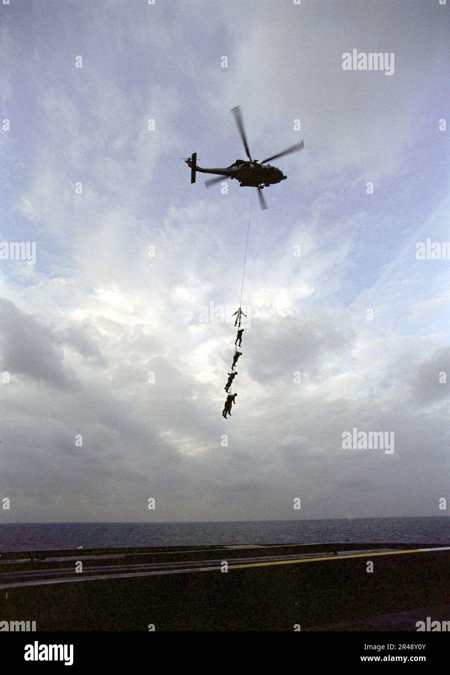 US Navy Sailors assigned to Truman participate in Special Purpose Insertion Extraction (SPIE) Rigging Exercises Stock Photo